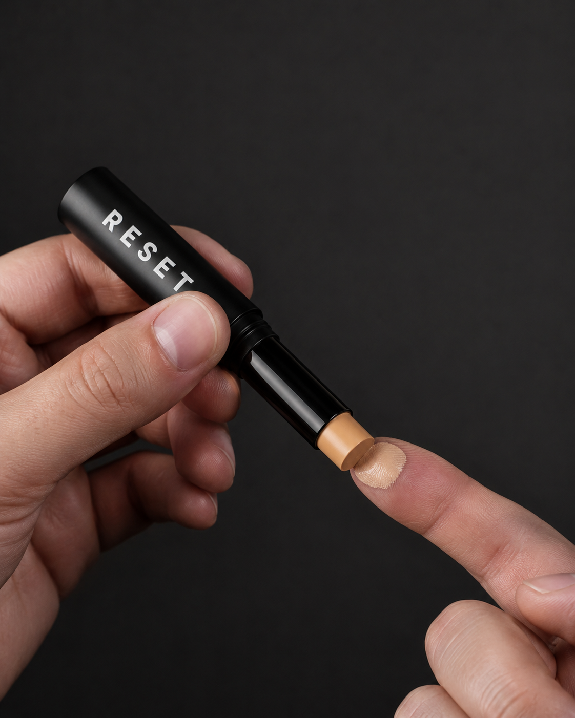 Applying RESET cream to fingertip — one-finger dab application